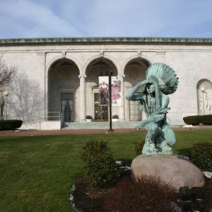 Front view of Butler museum with Native American statue in foreground