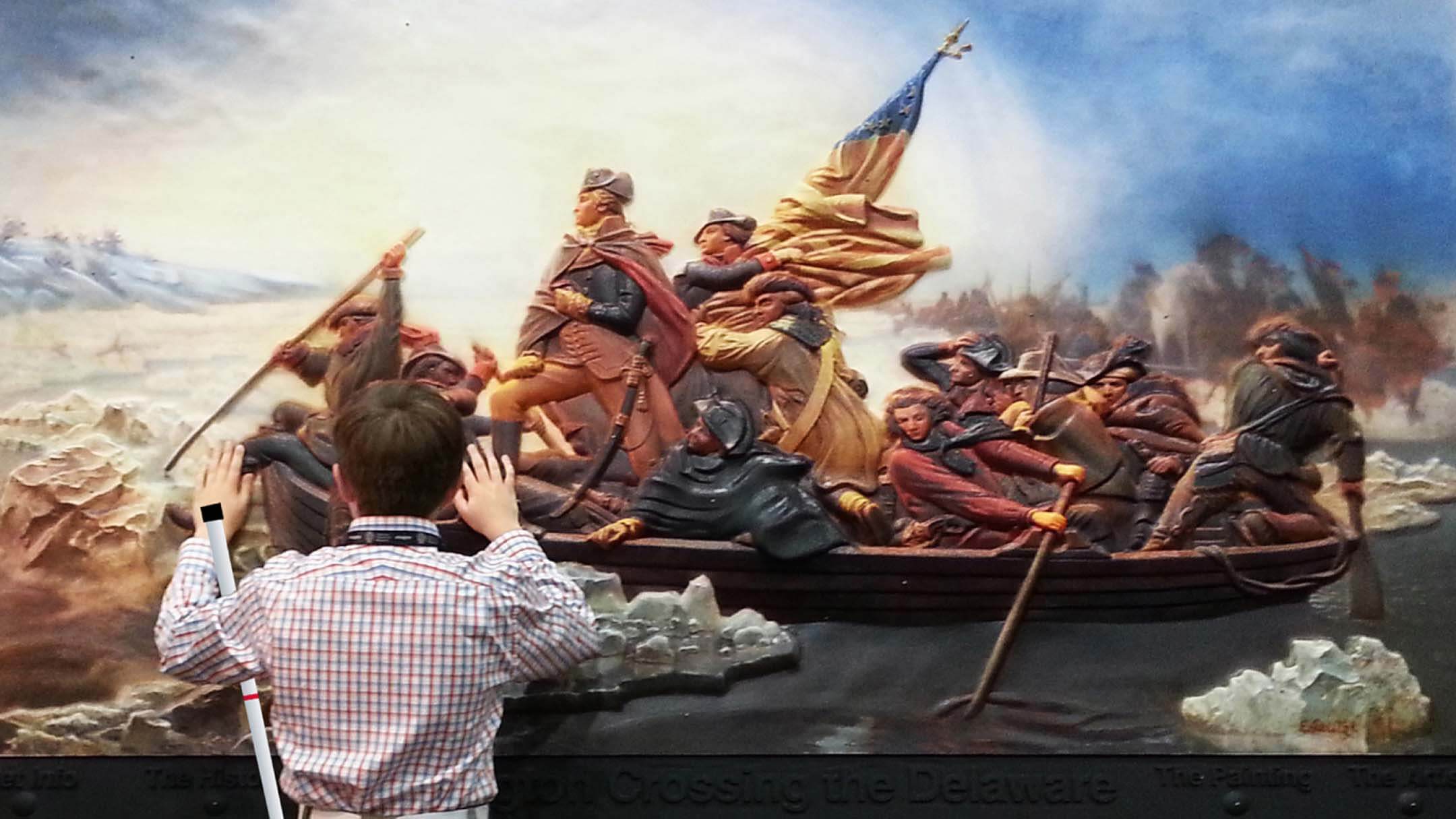 A large tactile display of George Washington and a group of Revolutionary Soldiers crossing a river. A blind man is touching the display with both of his hands.