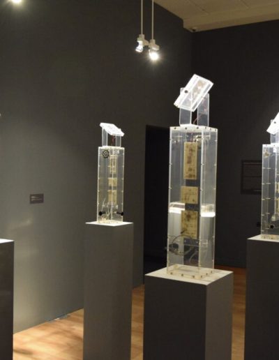 Overview of 4 sculptures featuring computer parts and clear plastic from Allan Erdmann