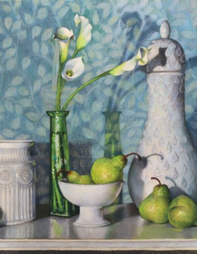 five pears on a table, two sit in a decorative white bowl, two sit in front of a decorative white decanter, one sits in front of a decorative white jar, a green glass flower vase with four white flowers, blue floral print background