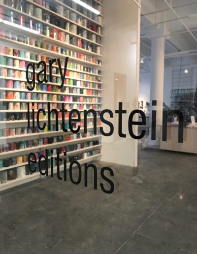 A photo looking into a studio with 'gary lichtenstein editions' on the door